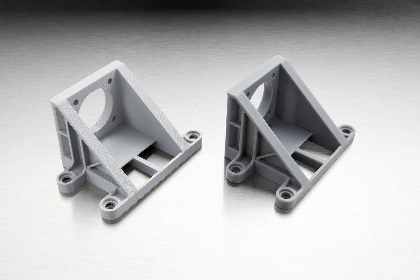 The difference in quality is less visible on relatively simple parts. However, SLA parts are dense and isotropic, which makes them better suited for many engineering and manufacturing applications (FDM part on the left, SLA part on the right).