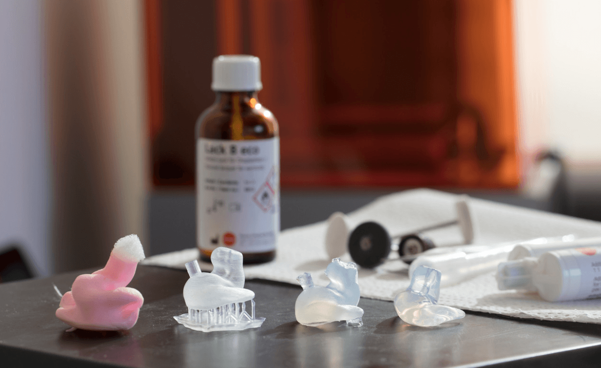 3D printed ear molds on a table